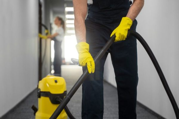 front-view-man-cleaning-indoors_23-2150454545